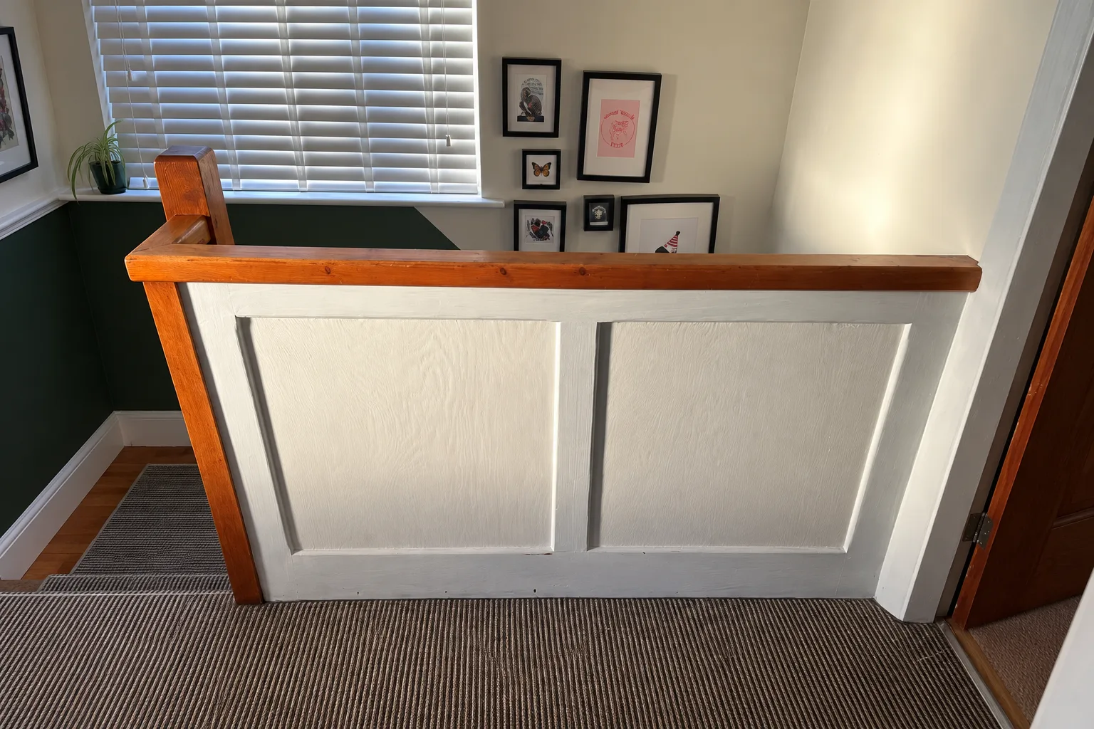 Before: solid landing panel and timber handrail in Nottingham
