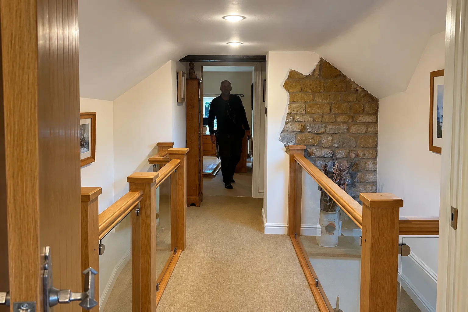 Oak and glass landing balustrade installed by L&R Joinery in Leicester