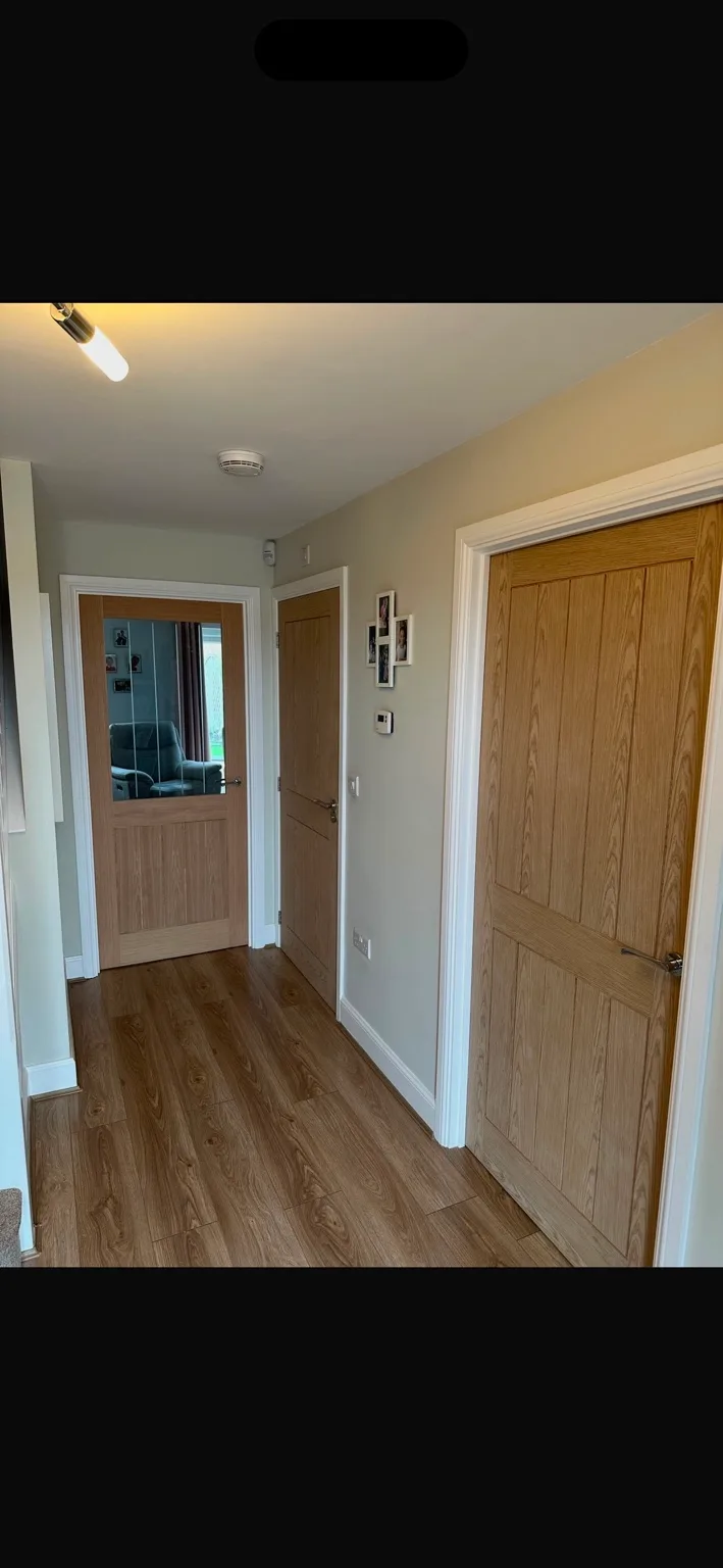 Oak internal doors installed in a home hallway by L&R Joinery