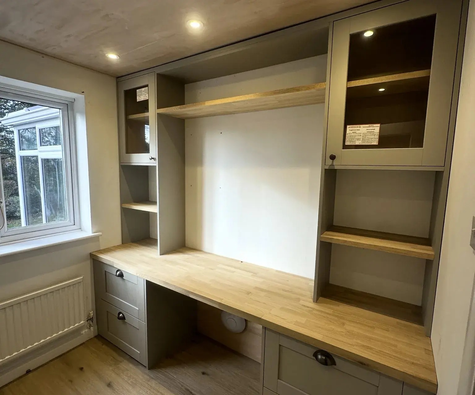 Bespoke built-in desk with grey shaker cabinets and oak worktop
