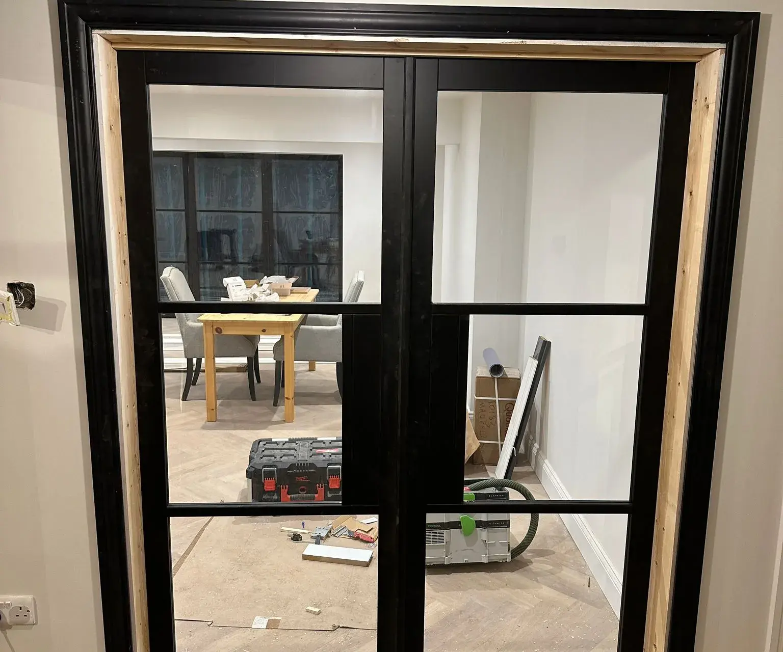 Black framed glass double doors installation