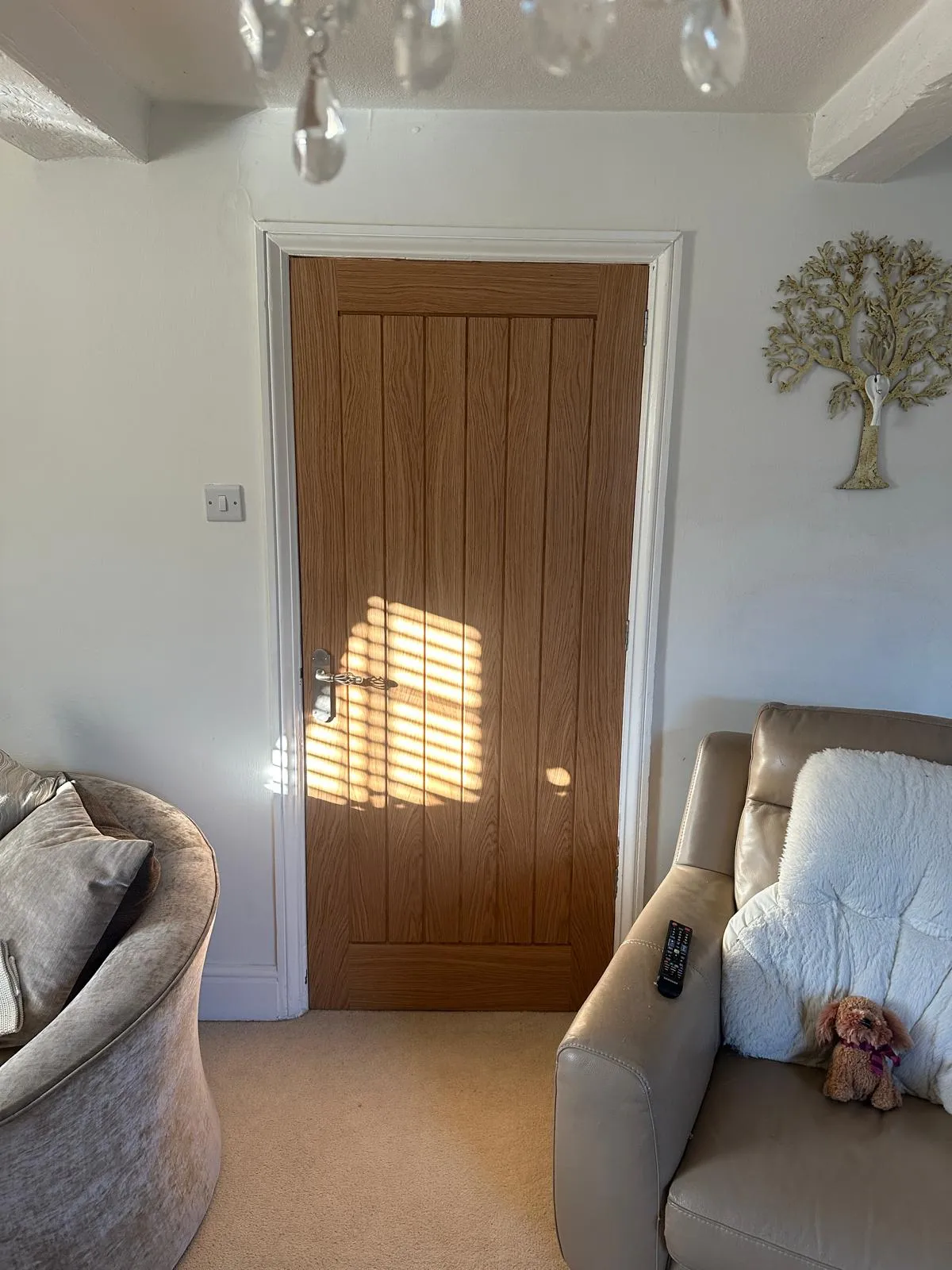 Oak plank internal door in cottage living room