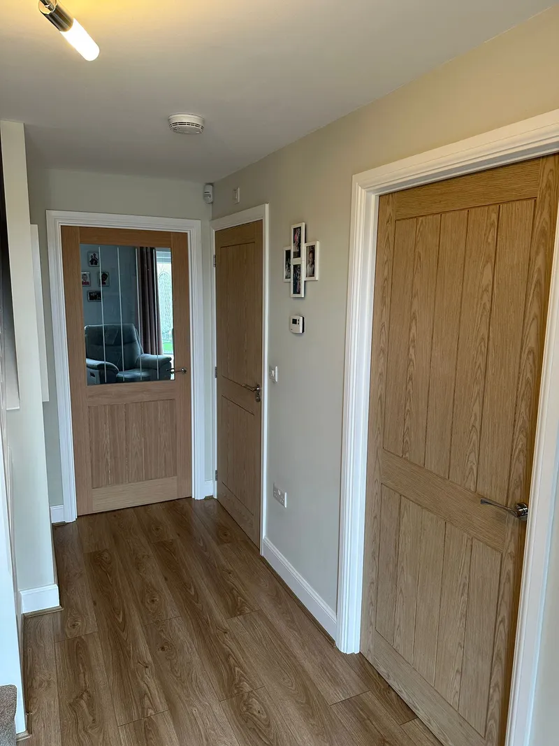 Oak panel internal doors with white architrave in hallway