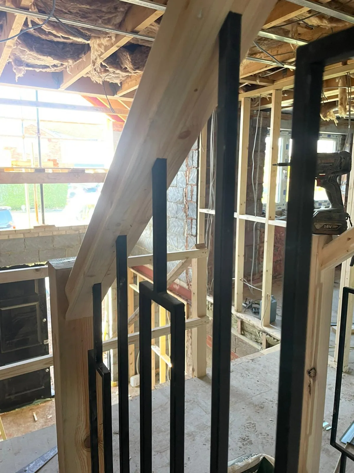 Metal spindle staircase in new build