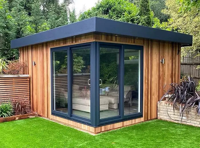 Cedar-clad garden room with corner glazing