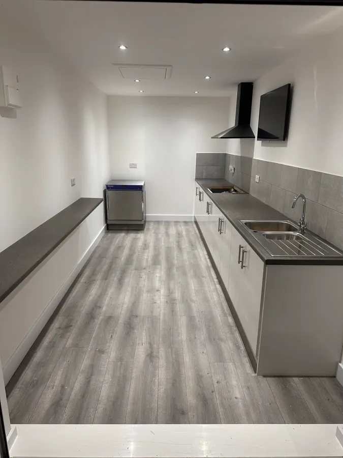 White and grey galley kitchen installation