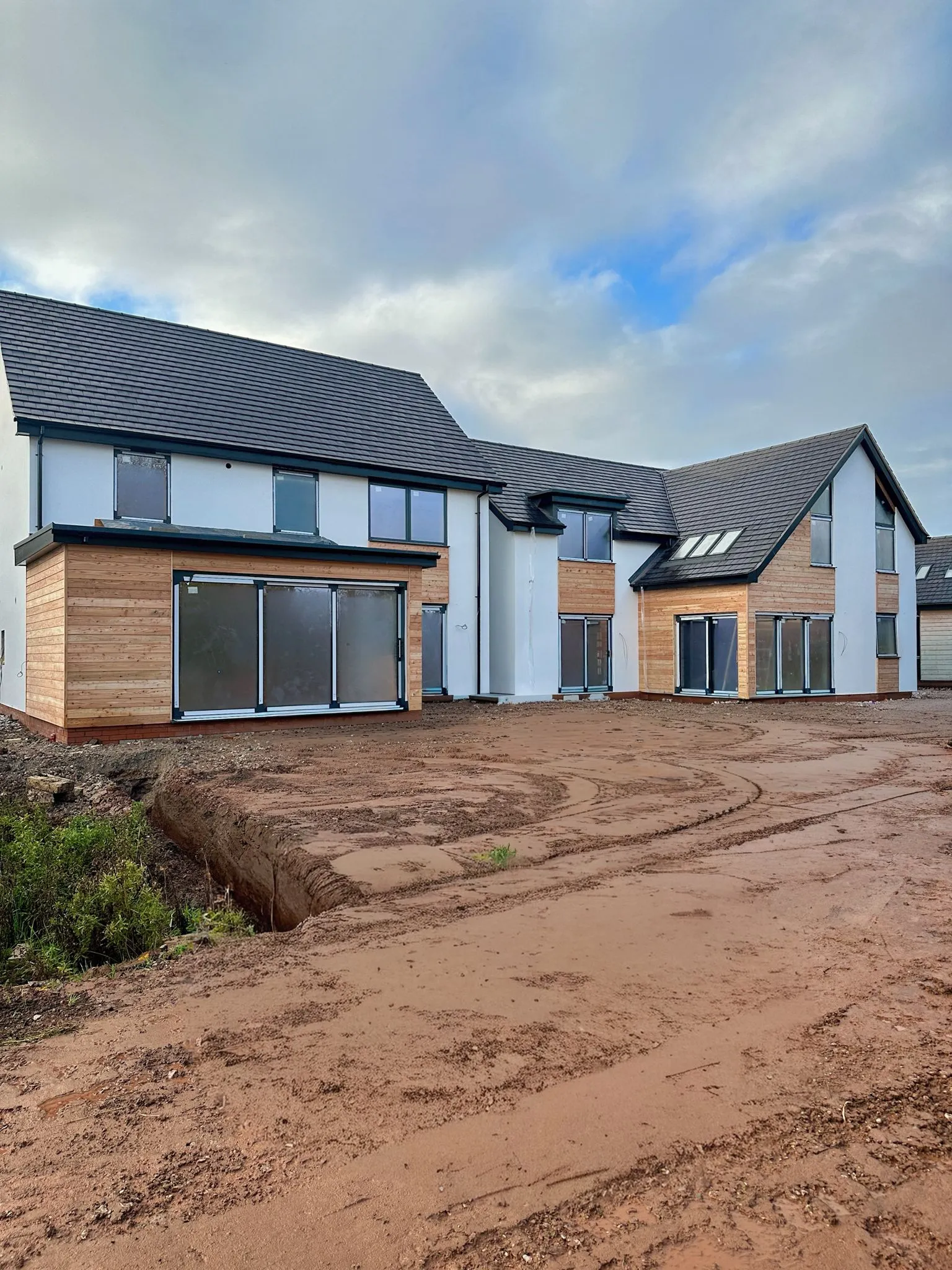Contemporary new build house with timber cladding