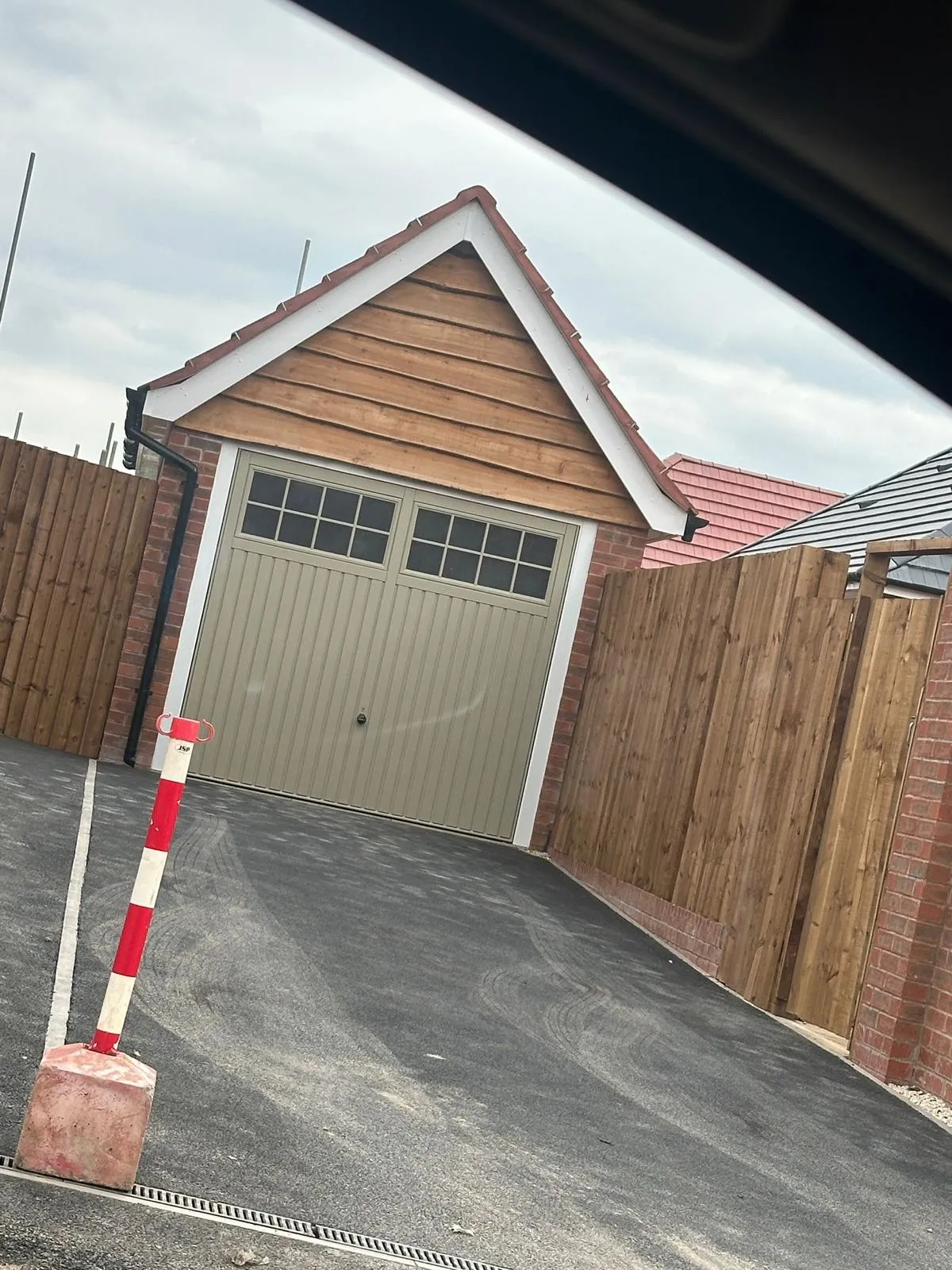 Completed garage outbuilding with timber cladding