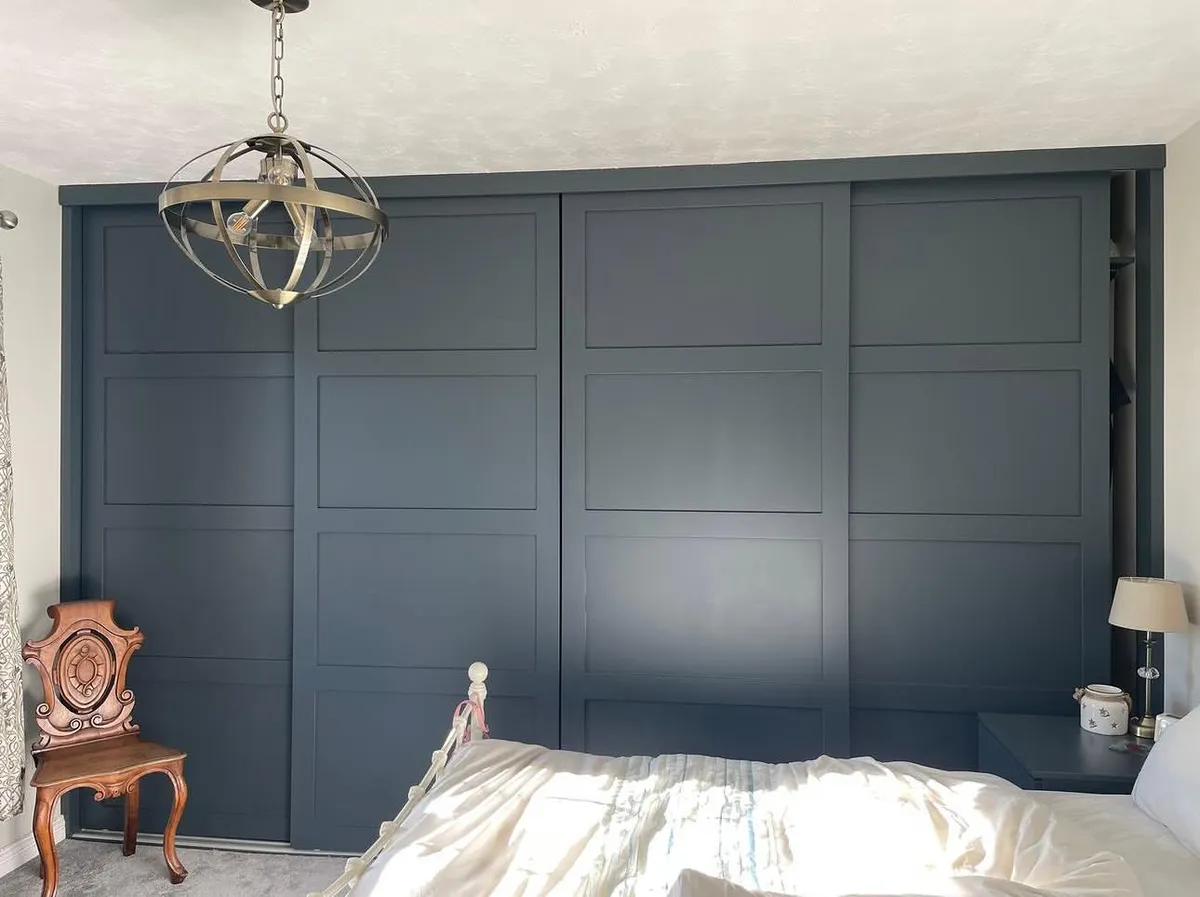 Dark grey shaker style sliding wardrobes in bedroom